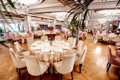 restaurant-hall-with-round-square-tables-some-chairs-plants